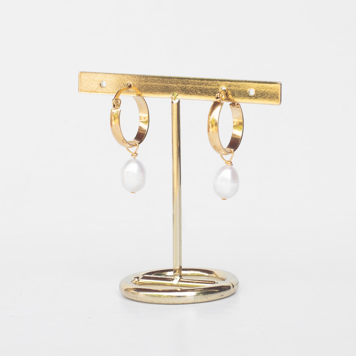Aros de perlas caídas