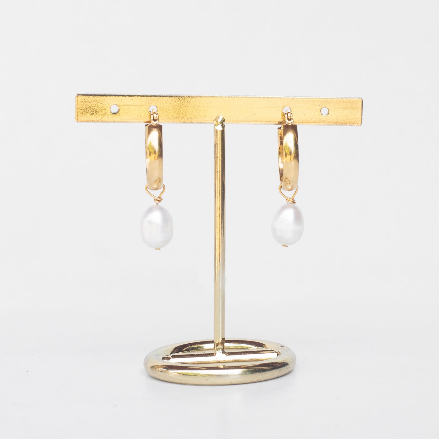 Aros de perlas caídas